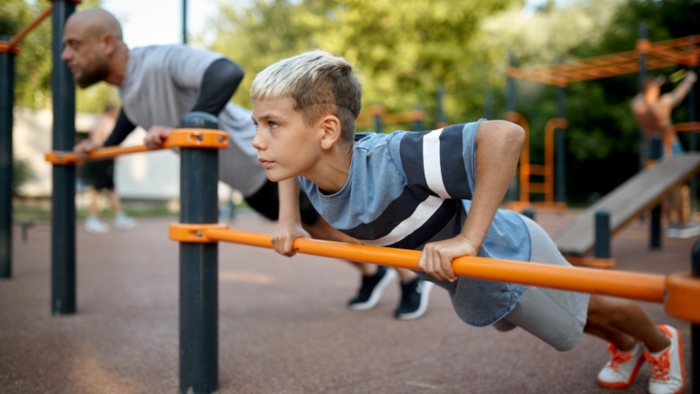 Father and child doing exercise, sport training