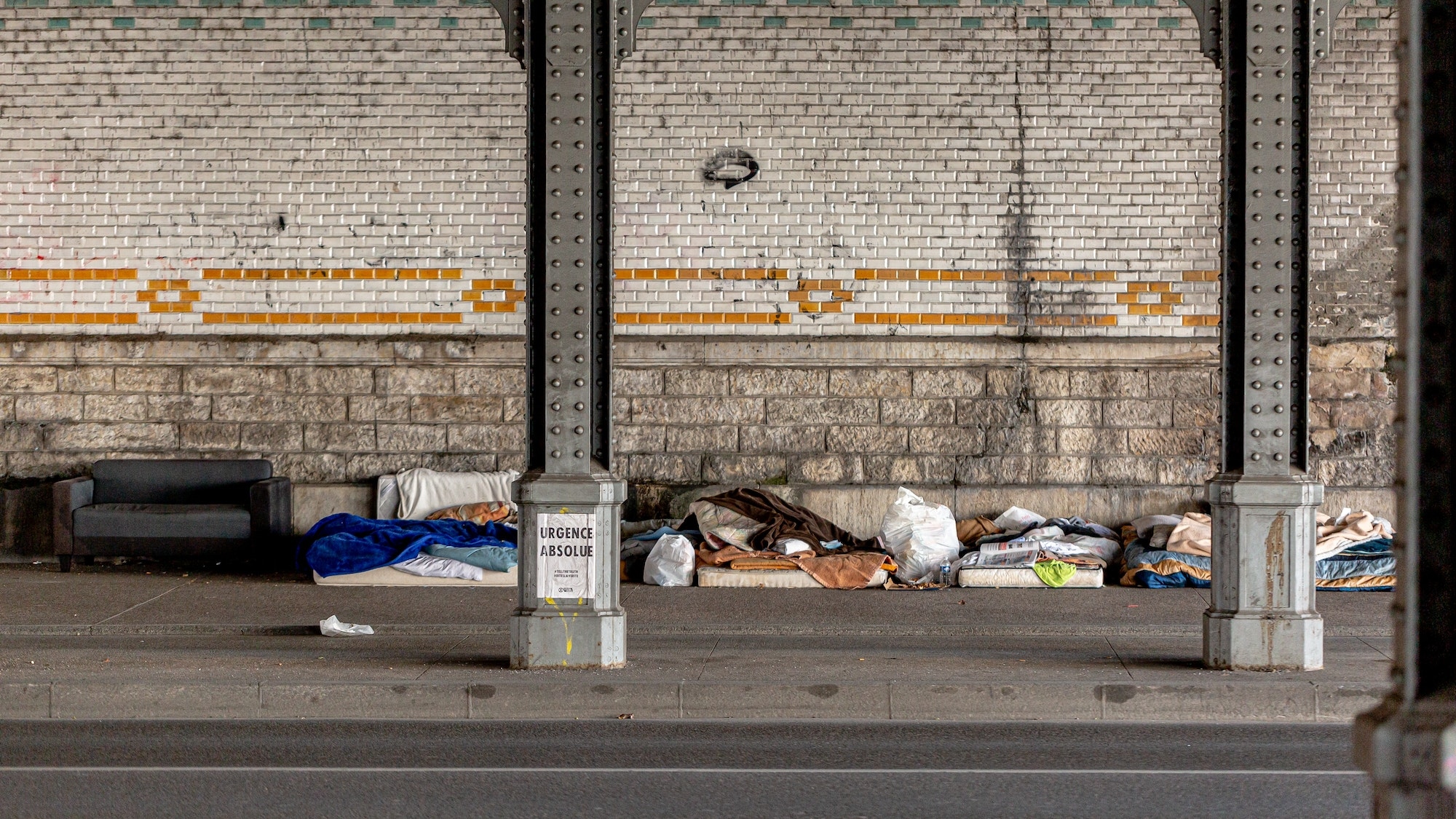Homeless people beds under the bridge